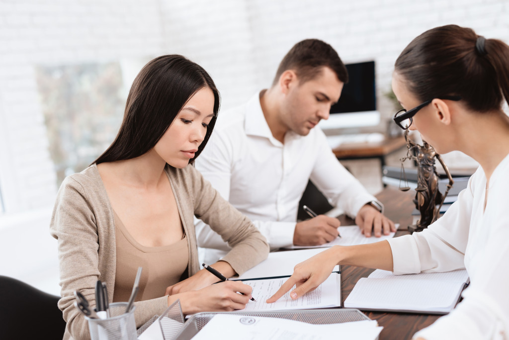 A couple in mediation in an attorney's office