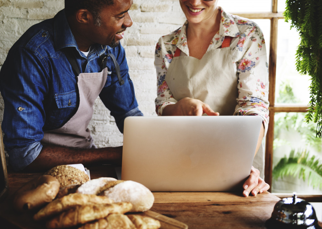 partner owners of a bakery setting up online